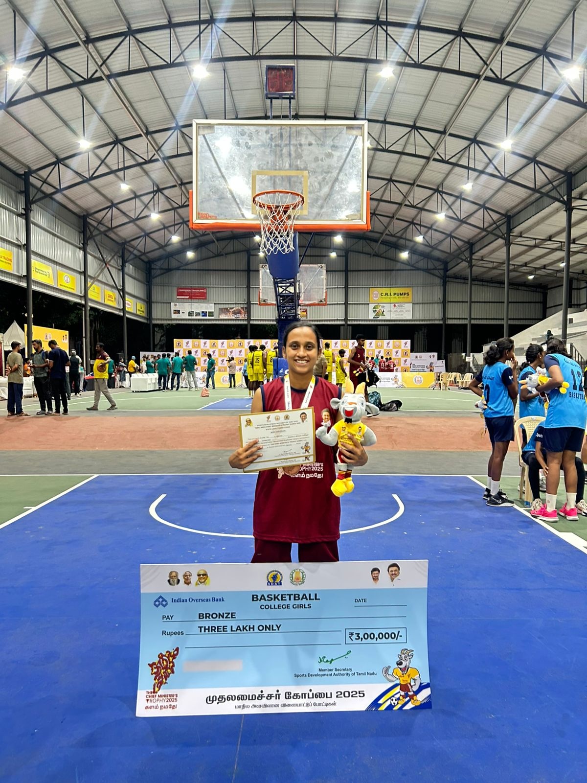 Ms. Subhiksha S with the CM Trophy basketball award